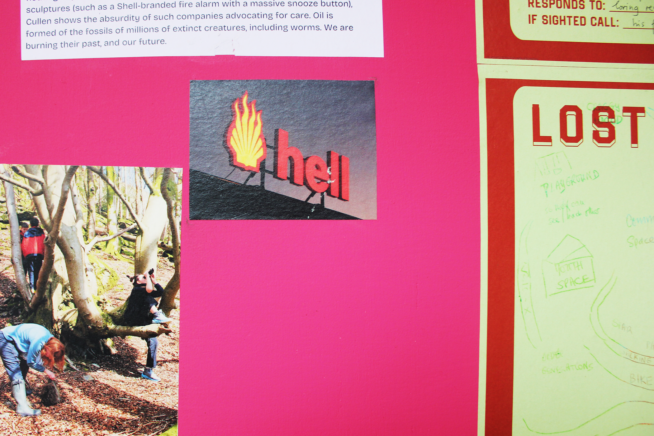 install close-up showing wild woods group kids in forest, hell bus logo and corner of LOST poster